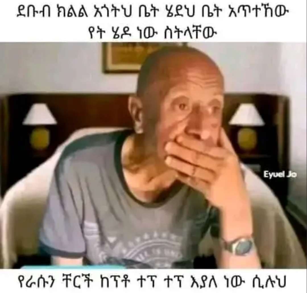 a man is sitting in a chair and eating something